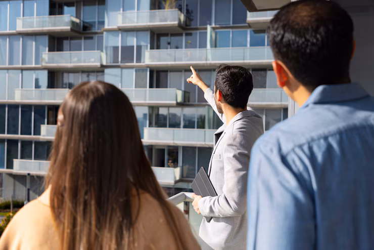 medium-shot-couple-talking-real-estate-agent_23-2150322085 how to establish real estate company